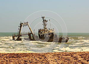 Shipwreck close to shore on Skeleton Coast, Namibia