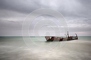 an shipwreck of a fishing boat during a stormy weather