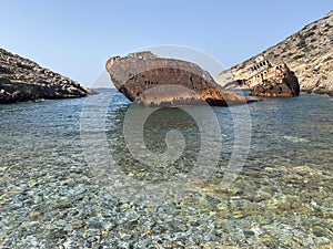 Shipwreck Olympia boat in Amorgos island during summer holidays, at the coastal rocky area, Cyclades, Greece. Travel background
