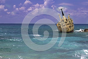 Shipwreck. Sunken ship on the rocks near the shore