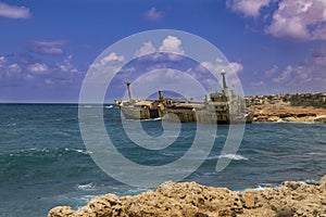 Shipwreck. Sunken ship on the rocks near the shore