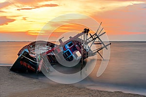 Shipwreck or wrecked boat on beach in the suset. Beautiful Landscape