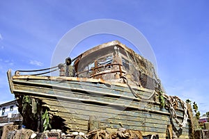 Shipwrecked boat in a harbour