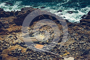 Shipwrecked vessel on a rocky shore