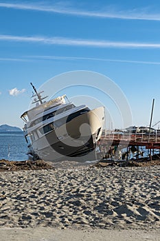 Shipwrecked yacht on a beach