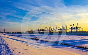 Shipyard cranes shipyard crane sunset winter container port Bremerhaven Germany