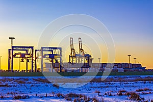 Shipyard cranes shipyard crane sunset winter container port Bremerhaven Germany