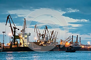 Shipyard with ships at dusk time