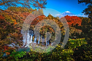 Shiraito Falls with Mt. Fuji and colorful autumn leaf in Fujinomiya, Shizuoka photo