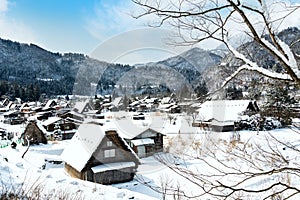 Shirakawa-go villages in snowfall day, Shirakawago famous Gassho-Zukuri houses steep thatched roofs, Village hill view point in