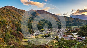 Shirakawago village Gifu Japan panorama, Historical Japanese traditional Gassho house in autumn foliage photo