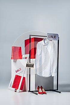 shirt on hanger, shopping bags and sale signs, summer