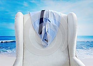 Shirt and tie hanging on a chair