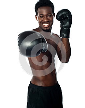 Shirtless african boxer ready to punch you