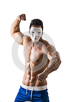 Shirtless aggressive muscle man with creepy, scary mask