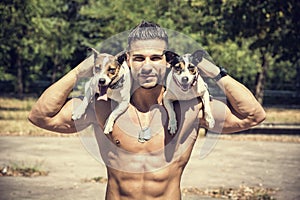 Shirtless Athletic Man with Dogs on his Shoulders