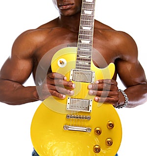 Shirtless black guy holding electric guitar