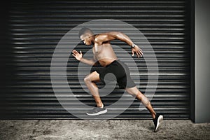 Shirtless, black man or sprint at speed, fitness or vision of exercise, energy or thinking of health. Fast, muscular or