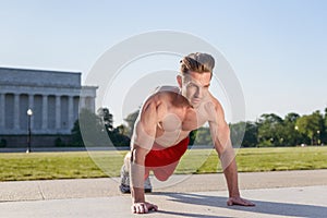 Fit Caucasian Man Doing Pushups During An Early Morning Workout