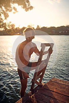 Shirtless handsome caucasian male bathing