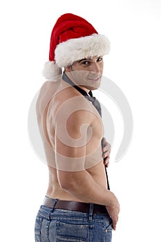 Shirtless male model posing with christmas hat