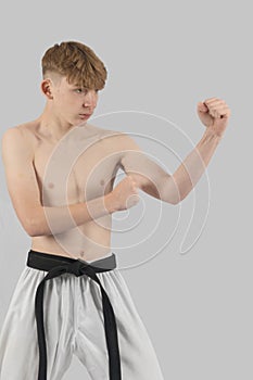 Shirtless Male Teenage Karate Black Belt