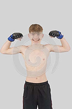 Shirtless male teenage MMA fighter