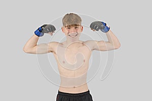 Shirtless male teenage MMA fighter