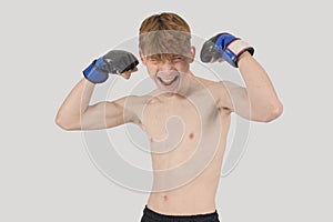 Shirtless male teenage MMA fighter