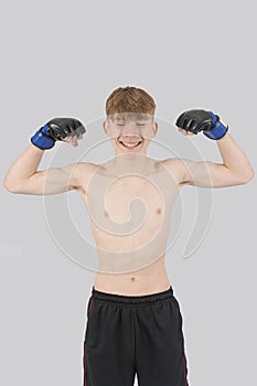 Shirtless male teenage MMA fighter photo