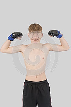 Shirtless male teenage MMA fighter photo