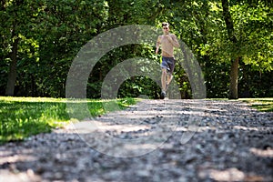 Shirtless Man Jogging Outdoors