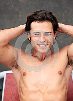 Shirtless man, portrait and sit ups for fitness, exercise and workout outdoors, bicep muscle and happy for health. Male