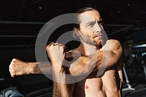 Shirtless man showcasing muscular physique, flexing photo