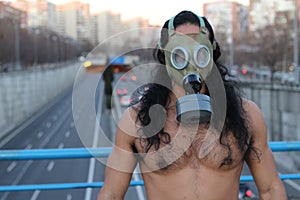 Shirtless man wearing retro pollution mask