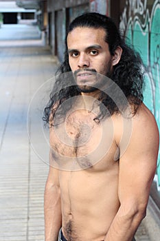 Shirtless muscular ethnic man isolated