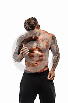 Shirtless muscular man with tattoos