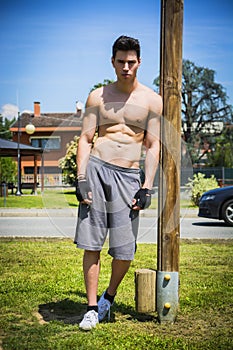 Shirtless young man resting after workout outdoor