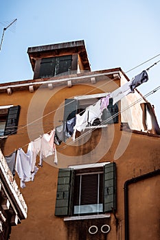 Shirts and laundry drying in the streets of venice