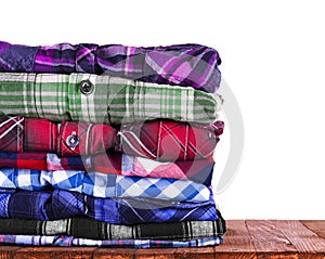 Shirts stack on wooden background