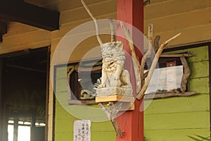 A Shisa guarding the store