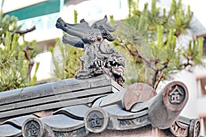 Shisa or Shishi ,Japanese male lion`s jaw image for lucky.