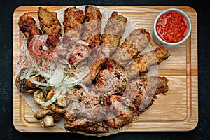 Shish kebab. with herb sauce and onion