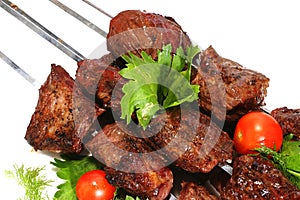 Shish kebab on skewer over white