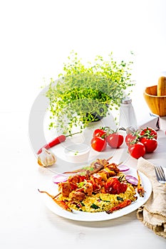 a Shish kebabs with vegetables and bulgur