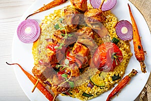 Shish kebabs with vegetables and bulgur