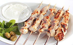 Shish taouk - Chicken shish kebab on white platter