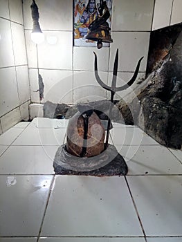 Shiv temple with the metal trishul and snake