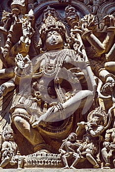 Shiva Lord sculpture on wall of old relief. 12th centur Hindu Hoysaleshwara temple in Halebidu, India