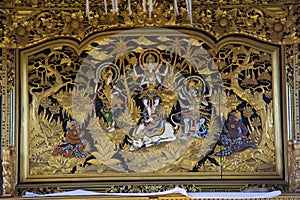 Shiva, Parvati and Ganesha carved in gold, Pura Besakih, Indonesia